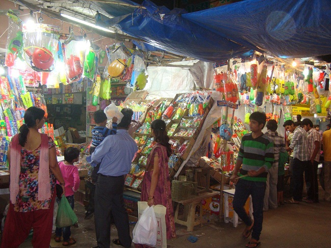 Parents are buying holi items for their children